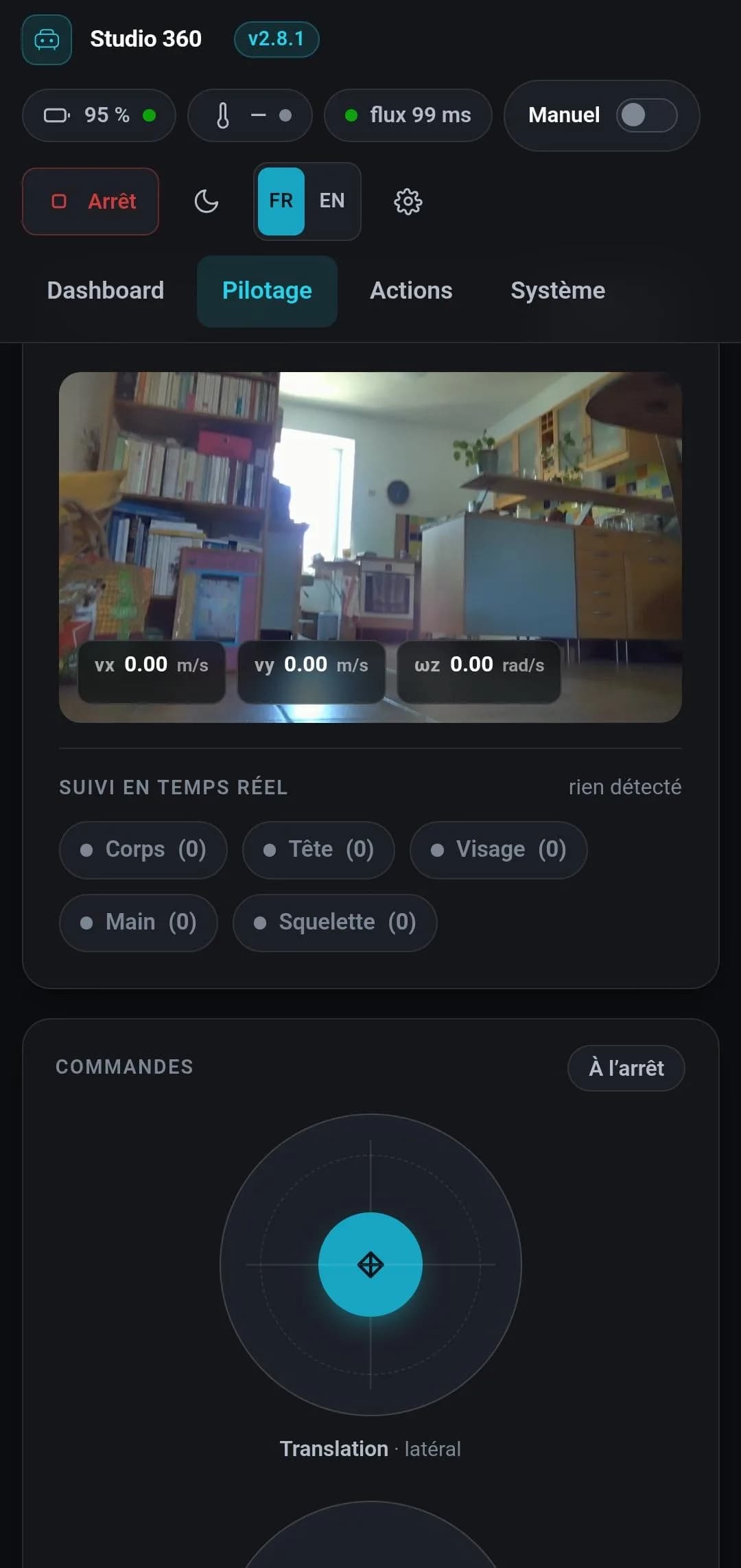 Studio 360 v2.8.1 on a phone: the robot camera view at floor level in a living room, speed overlaid, the tracking counters and the translation joystick